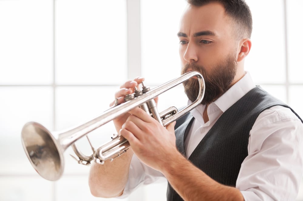 Bearded man playing the trumpet