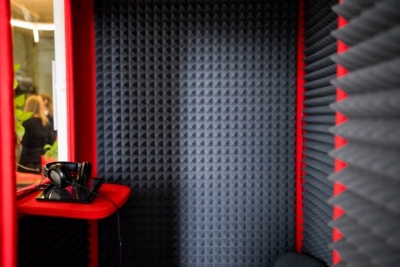A room with soundproofing foam on the walls for practicing the trumpet.