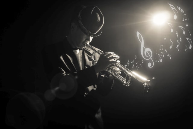Trumpeter under a spotlight